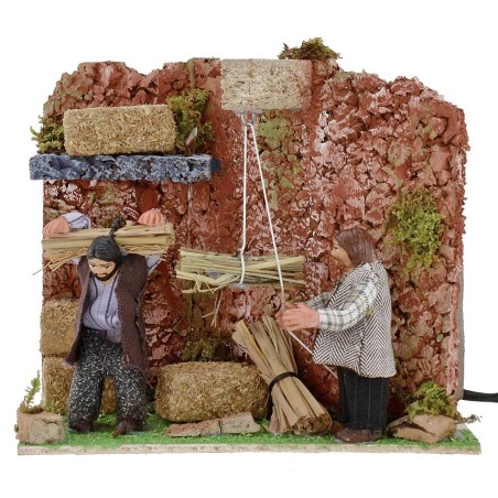 Campesinos en el granero con doble movimiento 8 cm Mundo Pesebres