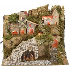 Belén iluminado con pueblo y paisaje de 28x15x23 cm de altura completo.