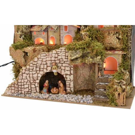 Belén iluminado con pueblo y paisaje de 28x15x23 cm de altura completo.