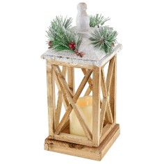 Snow-covered wooden lantern with battery-powered candle