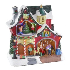 Christmas scenario with little house and carousel complete with