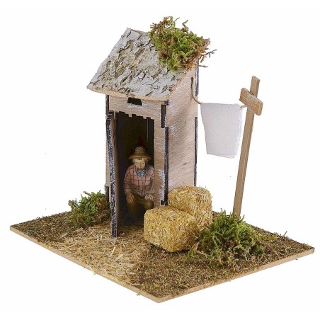 Setting with latrine and wooden drying rack for nativity scene