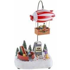 Escenario navideño con dirigible a pilas completo de música e