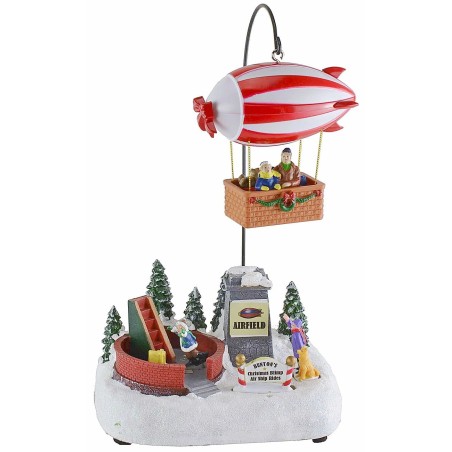 Scenario natalizio con dirigibile funzionante a batterie