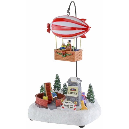 Escenario navideño con dirigible a baterías.
