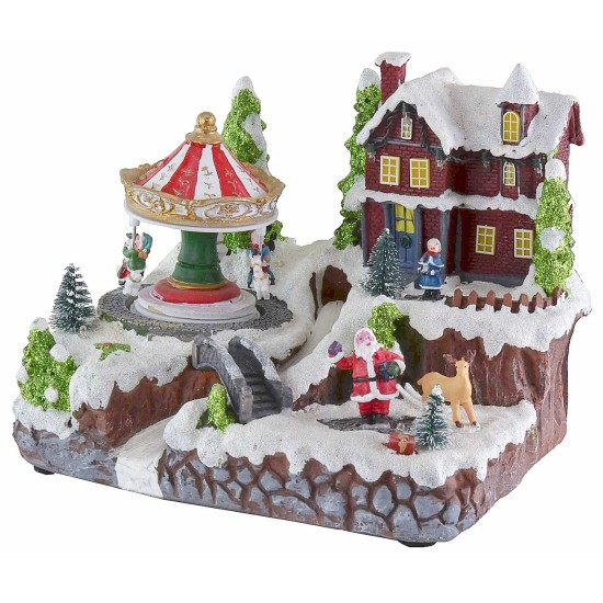 Pueblo navideño con carrusel que funciona con baterías y luces.