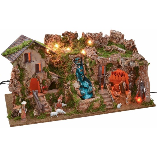 Illuminated nativity scene with cave, waterfall and fire