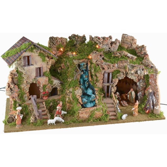 Illuminated nativity scene with cave, waterfall and fire