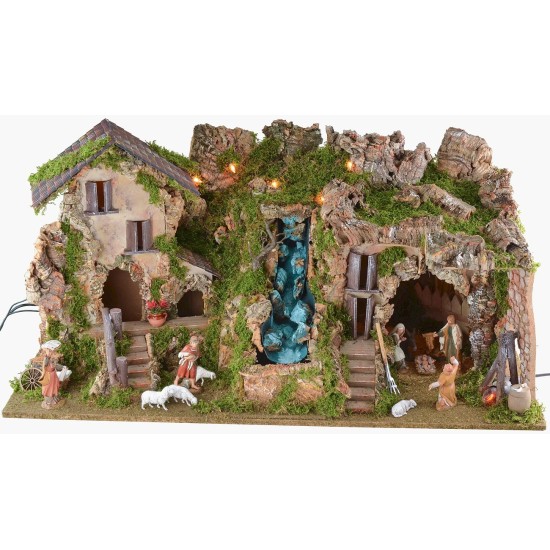 Illuminated nativity scene with cave, waterfall and fire