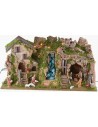 Illuminated nativity scene with cave, waterfall and fire