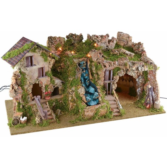 Illuminated nativity scene with cave, waterfall and fire