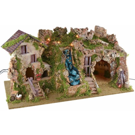 Illuminated nativity scene with cave, waterfall and fire