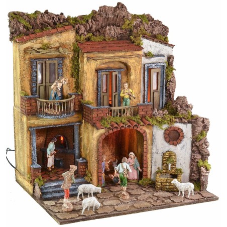 Illuminated nativity scene with working oven and fountain in 18th century style
