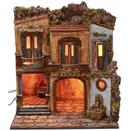 Pueblo iluminado con horno y fuente en funcionamiento estilo