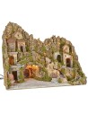 Illuminated nativity scene with cave, fountain, waterfall and