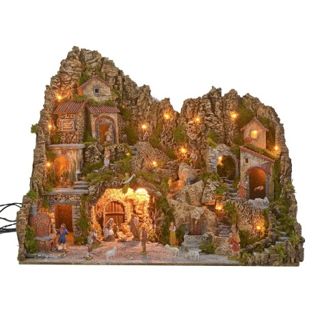 Illuminated nativity scene with cave, fountain, waterfall, and fire