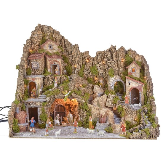 Illuminated nativity scene with cave, fountain, waterfall, and fire