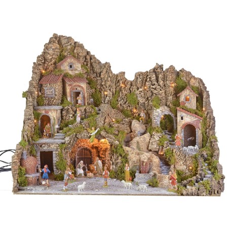 Illuminated nativity scene with a grotto, fountain, waterfall