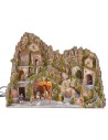 Illuminated nativity scene with a grotto, fountain, waterfall