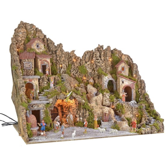Illuminated nativity scene with cave, fountain, waterfall and fire