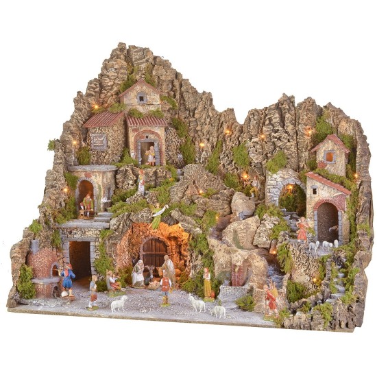 Illuminated nativity scene with cave, fountain, waterfall, and fire