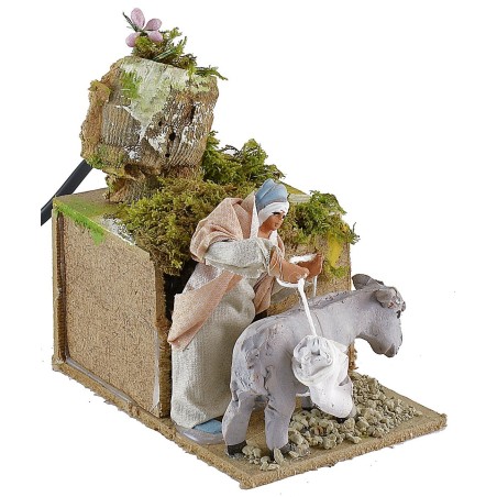 Mujer en movimiento con burro Mundo Belenes