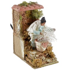 Woman sewing the fishing net 2