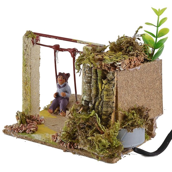 Bambino sull'altalena serie 10 cm in movimento Mondo Presepi