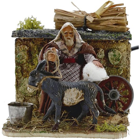 Uomo 8 cm che striglia l'asino in movimento cm 15x10x9 h. Mondo