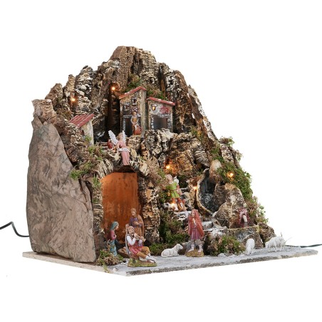 Illuminated nativity scene with working waterfall and fountain complete