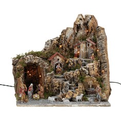 Illuminated nativity scene with working fountain and complete with statues