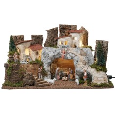 Presepe con grotta in pietra bianca completo di statue Landi