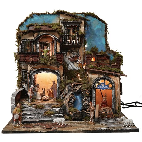 Illuminated nativity scene with functioning waterfall and fire effect