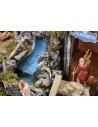 Illuminated nativity scene with functioning waterfall and fire effect