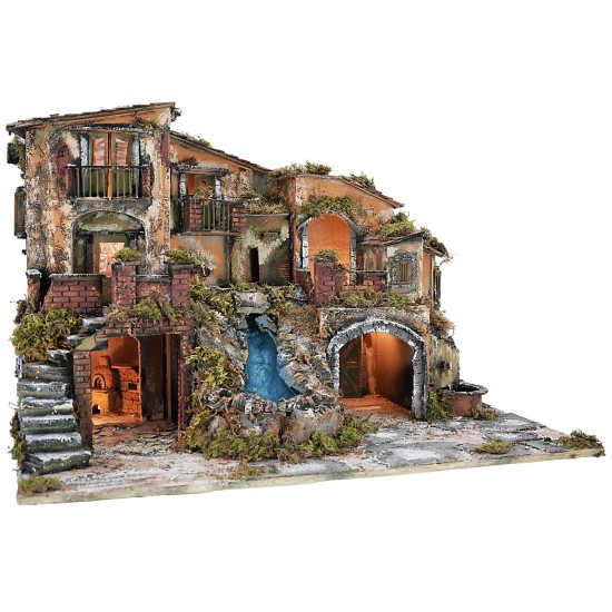 Illuminated nativity scene with waterfall, fountain, and