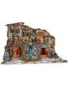 Illuminated nativity scene with waterfall, fountain, and