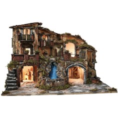 Illuminated nativity scene with waterfall, fountain, and 2