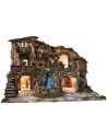 Illuminated nativity scene with waterfall, fountain, and