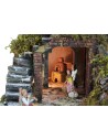 Illuminated nativity scene complete with statues, waterfall