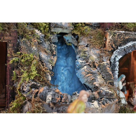 Belén iluminado completo de estatuas con cascada, fuente y