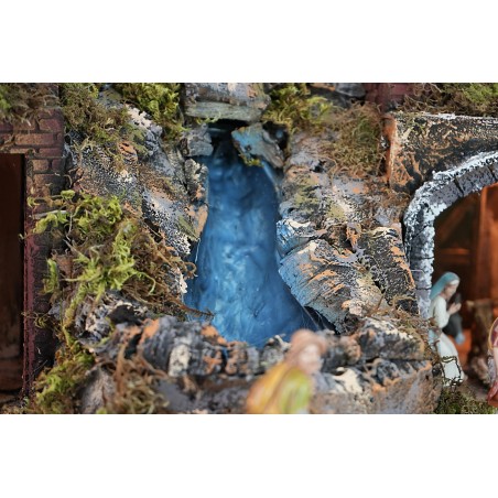 Belén iluminado completo con estatuas, cascada, fuente y