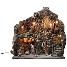 Presepe illuminato con villaggio su montagna completo di statue