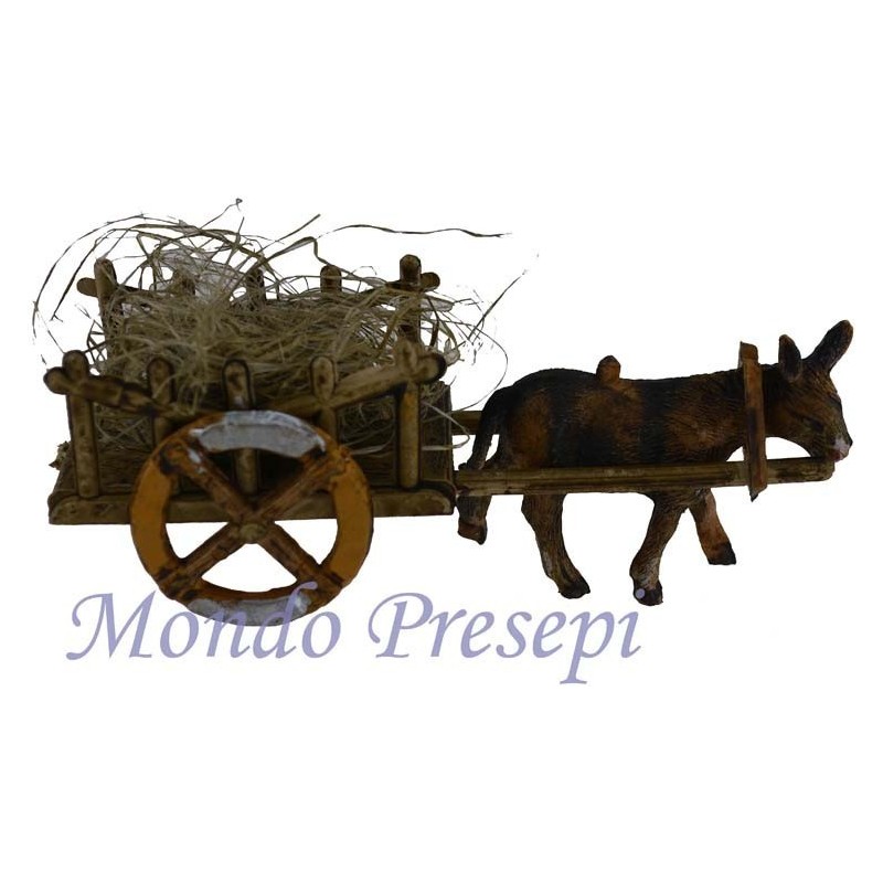 Wagon of straw with a donkey in tow
