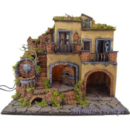 Nativity scene with illuminated village with fountain and oven 50x40