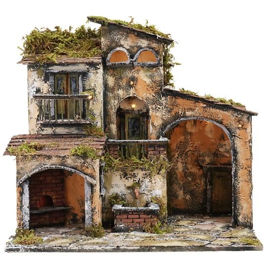 Belén iluminado con fuente y horno en funcionamiento de 46x32x45 cm.