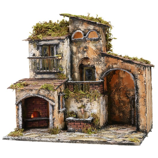 Illuminated nativity scene with working fountain and oven, dimensions 46x32x45 cm.