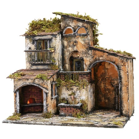 Illuminated nativity scene with working fountain and oven, dimensions 46x32x45 cm.