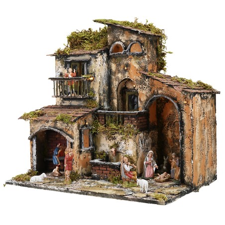 Illuminated nativity scene with working fountain and oven, dimensions 46x32x45 cm.