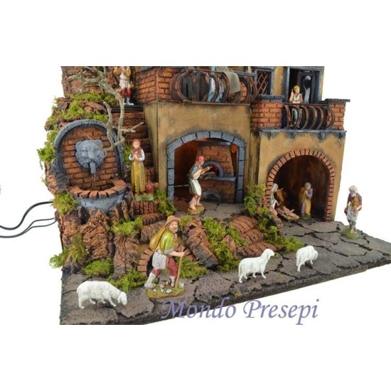 Complete nativity scene with Landi statues illuminated with fountain and