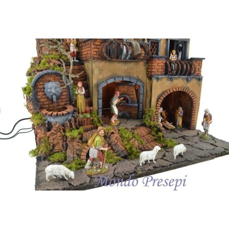 Complete nativity scene with Landi statues illuminated with fountain and